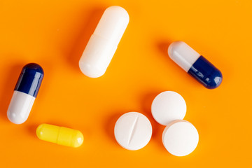 White round pills and color capsules