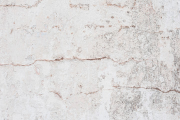 Wall fragment with scratches and cracks