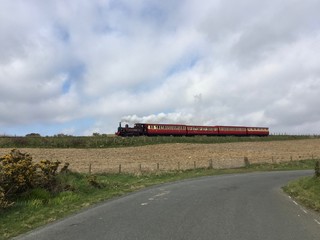 A steam train passing in the vicinity of Port Soderick, Isle of Man.