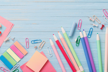 school supplies on  blue wooden background