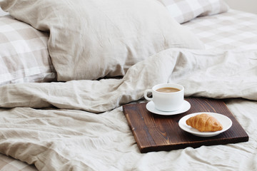 Fototapeta na wymiar coffee on tray on the bed in bedroom