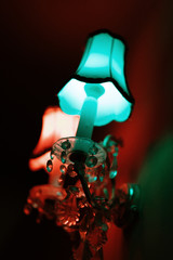 wall crystal sconces with pendants. red and blue lighting. similar to the effect of 3d. great decor for a pub or cafe. selective focus