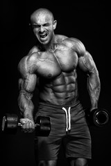 Fototapeta na wymiar Bodybuilder Lifting Weights