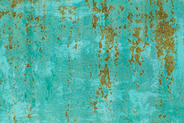Closeup flatlay texture of old rusty metal painted in green bright color. Horizontal abstract photography.