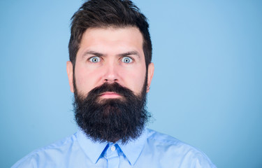 Unshaven and handsome. Caucasian hipster. Bearded man with fashion haircut. Brutal man with long beard hair and mustache. Growing a hipster beard. Barber salon or barbershop, copy space