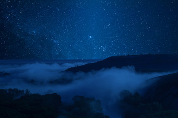 Night landscape with fog in valley