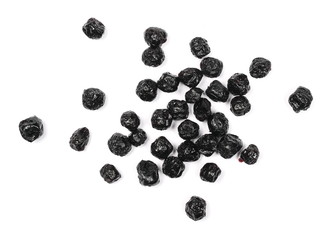 Dried aronia berries isolated on white background, top view