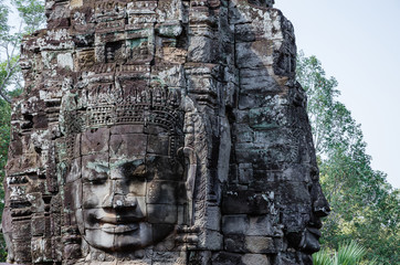 Fototapeta na wymiar Smiling Faces of Bayon Temple in Angkor Thom is The Heritage of Khmer Empire at Siem Reap Province, Cambodia.