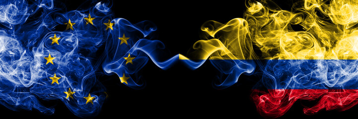 European Union vs Colombia, Colombian smoke flags placed side by side. Thick colored silky smoke flags of EU and Colombia, Colombian
