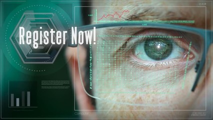 A close up of a businessman eye controlling a futuristic computer system with a Register Business concept.