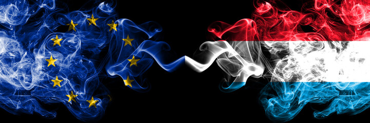European Union vs Luxembourg smoke flags placed side by side. Thick colored silky smoke flags of EU...