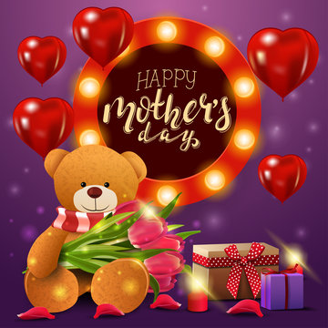Happy mother's day, greeting postcard with Teddy bear with a bouquet of tulips