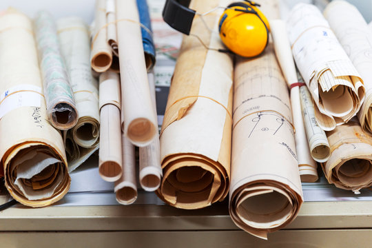 Historic Blue Print Scrolls Bound And Stacked Together.