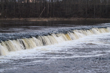 Beautiful countryside view of river Venta flowing through Ventas rumba in Kuldīga.
