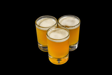 Summer yellow cocktail on isolated black background