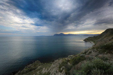 Fototapeta na wymiar Beautiful clouds in the sky at sunset on the Black Sea coast in Crimea
