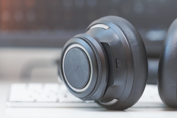macro wireless  bluetooth over-the-ear headphones on computer keyboard