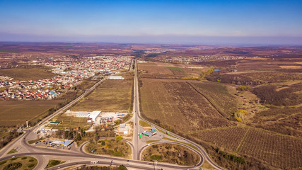 Cinematic aerial footage. The village road.