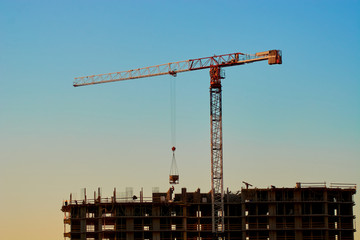 construction of the building cranes in the strongest light, otherwise