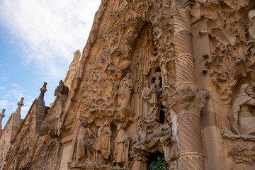 Barcelona, Spain, 14 March 2019.A fragment of the wall Sagrada Familia against the blue sky and...