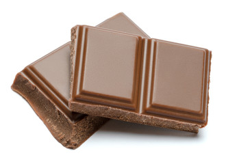 Milk organic chocolate pieces isolated on white background