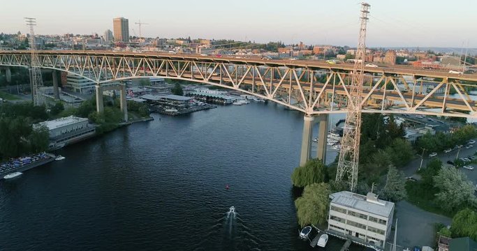 Boat Traveling Under Large Bridge Seattle Washington Lake Union Montalke Cut University District Background Aerial Wide Angel Overview