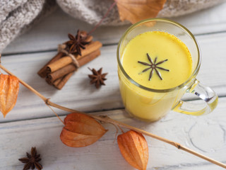 Fototapeta premium Golden milk or milk with turmeric. Alternative medicine of Eastern countries