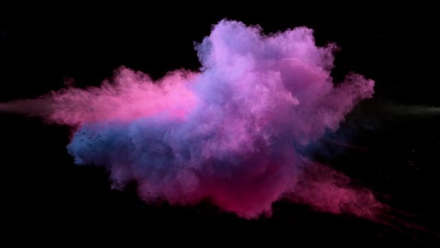 Super slow motion of coloured powder collision isolated on black background. Filmed on high speed cinema camera, 1000fps.