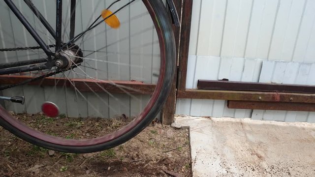 The Wheel spinning on an old bike. The wheel is spinning.