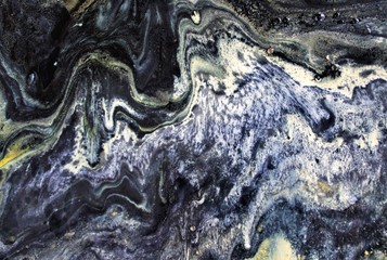 Abstract artistic texture. Liquid ink mixing in water. Color creating an interesting structure....
