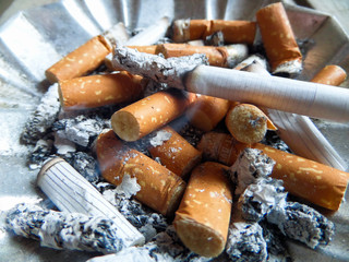 Cigarettes in an ashtray. A bad habit