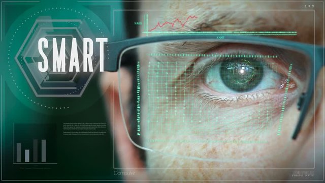 A close up of a businessman eye controlling a futuristic computer system with a SMART Business concept.