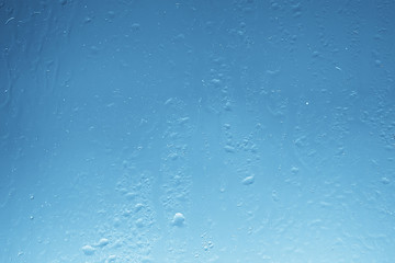 wet glass background condensate / abstract rain, drops texture on transparent glass