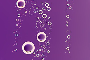 purple wet background / raindrops for overlaying on window, weather, background drops of rain water on glass transparent