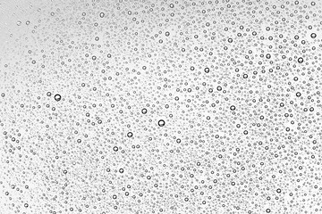 white isolated background water drops on the glass / wet window glass with splashes and drops of water and lime, texture autumn background