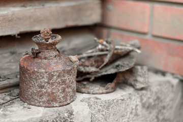 Old rusty broken oil lamp