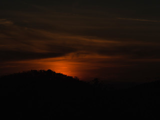 Fototapeta na wymiar sunset time sun fall to mountain back side become to darkness 