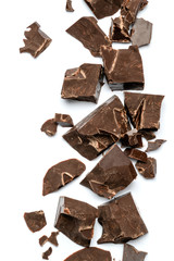 Dark or milk organic chocolate pieces isolated on white background
