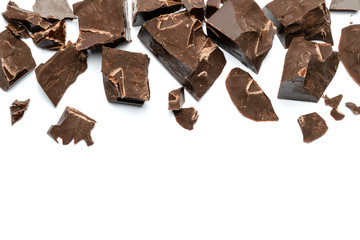 Dark or milk organic chocolate pieces isolated on white background