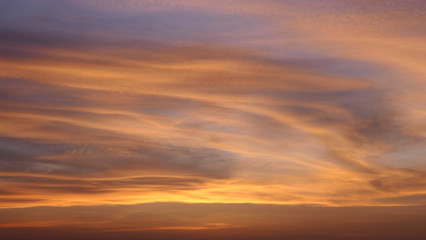 Beautiful sky with golden clouds in the west