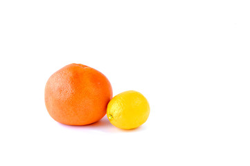 Grapefruit and lemon on the table on a white background.