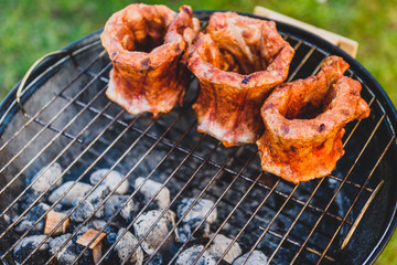 Baby Back Ribs Crown Roast on BBQ barbecue kettle grill.