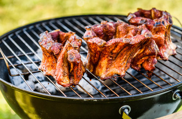 Baby Back Ribs Crown Roast on BBQ barbecue kettle grill.