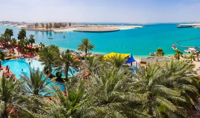 Gordijnen Beautiful resort area overlooking the pool and the sea in Abu Dhabi, UAE © olgavolodina