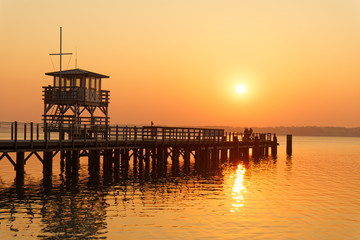 Obraz premium Sunset at the sea bridge in Glücksburg (Baltic Sea), Schlewig-Holstein,Germany