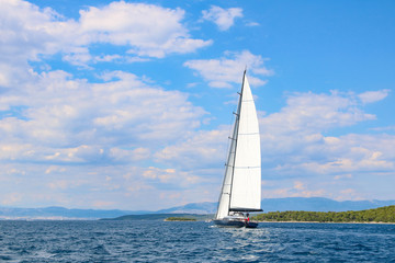 Fototapeta premium large sailboat in the Adriatic sea on blue and cloud sky background