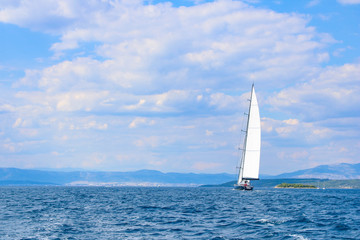 Fototapeta na wymiar large sailboat in the Adriatic sea on blue and cloud sky background
