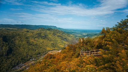 see beautiful scenery from the top of a green hill