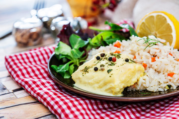 Andalusian fish, saffron rice with vegetables
