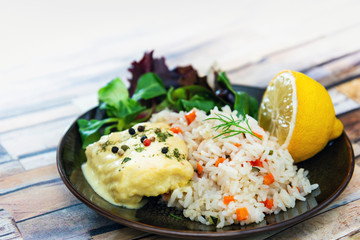 Andalusian fish, saffron rice with vegetables
